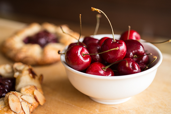 A bowl of fresh cherries for homemade Cherry Galettes | thecozyapron.com