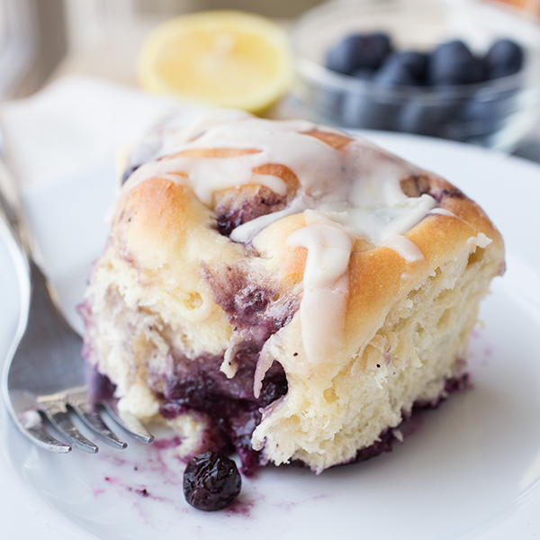 A fresh-baked Blueberry Roll on a plate | thecozyapron.com