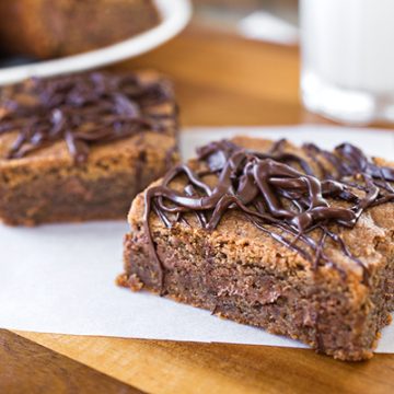 Chocolate Peanut Butter Cookie Bars with a glass of milk | thecozyapron.com
