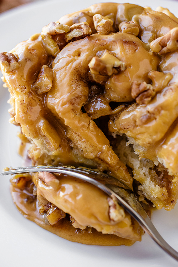 Fluffy Caramel Apple Cinnamon Roll with Caramel-Cider Glaze | thecozyapron.com