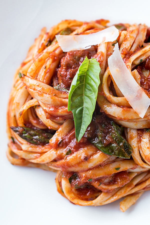 Closeup on a plate of Linguine Pasta with Sausage and Artichoke | thecozyapron.com