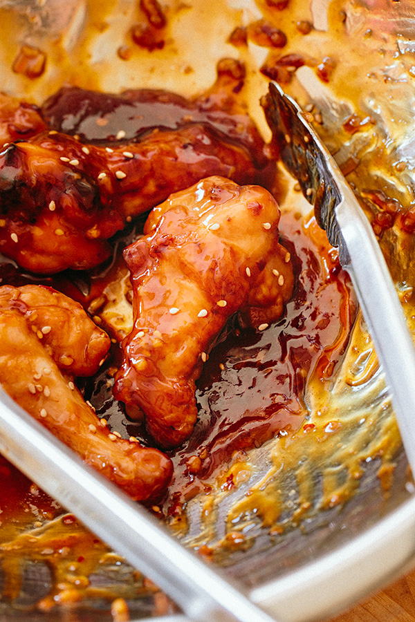 Spicy Orange Chicken Wings Tossed in Sauce | thecozyapron.com