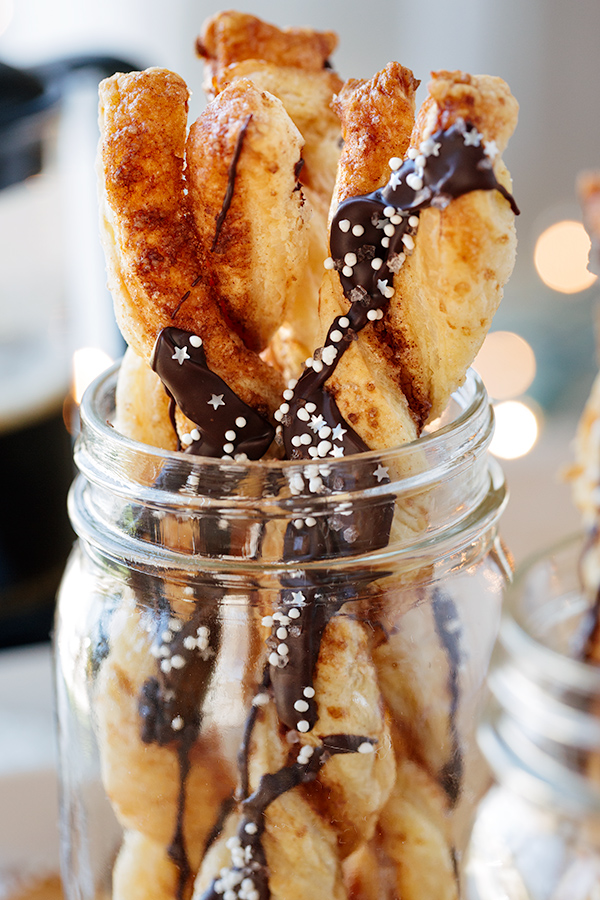 Closeup on Chocolatey Cinnamon Twists in a mason Jar | thecozyapron.com