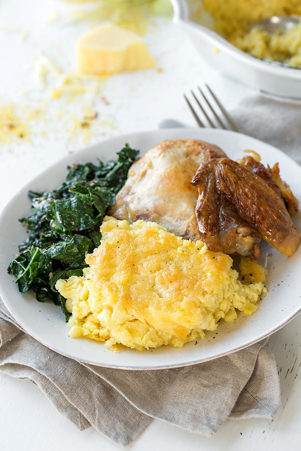 A plateful of Polenta Casserole with chicken and cooked greens | thecozyapron.com