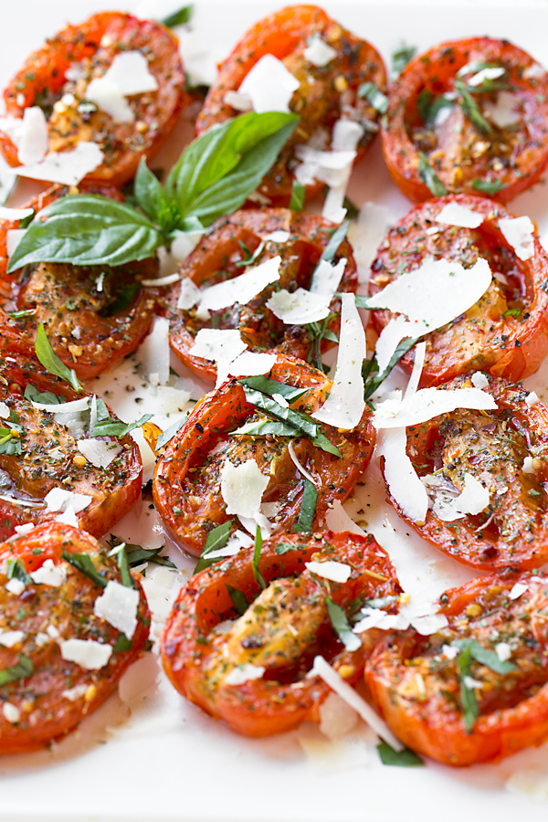 Succulent Roasted Tomatoes on a white serving platter | thecozyapron.com