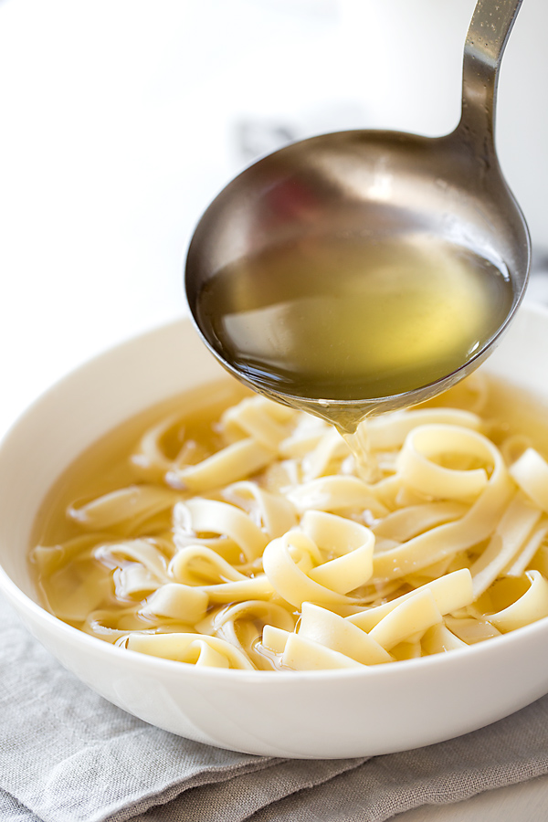 Bowl of Homemade Chicken Broth with Noodles | thecozyapron.com