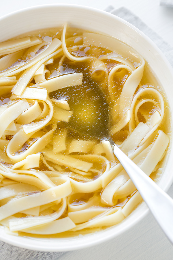 Bowl of Homemade Chicken Broth with Noodles | thecozyapron.com