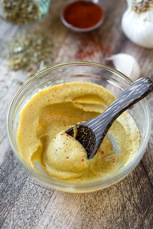 A ramekin of Dijon mustard and spices| thecozyapron.com