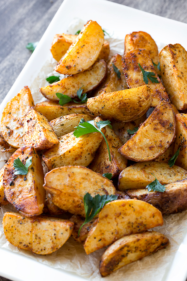 Roasted Potatoes on a serving dish, fresh out of the oven | thecozyapron.com