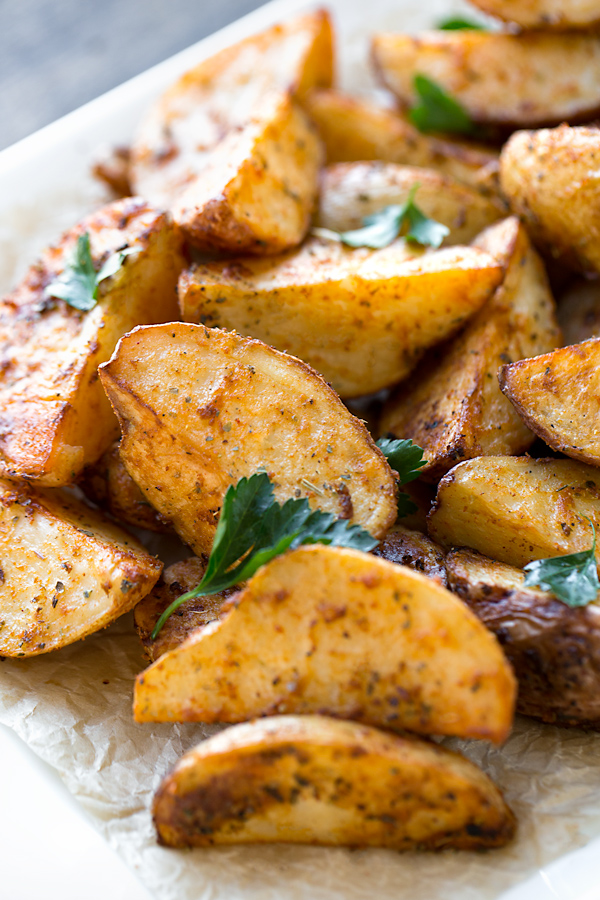 Closeup on Roasted Potatoes on a serving dish, fresh out of the oven | thecozyapron.com