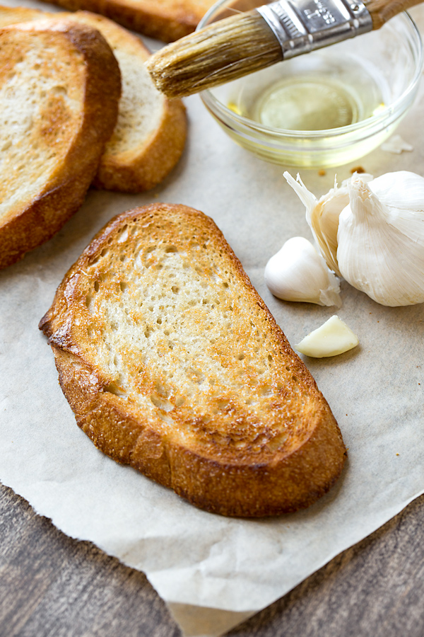 Garlic and olive oil rubbed toast for Caprese Toasts | thecozyapron.com