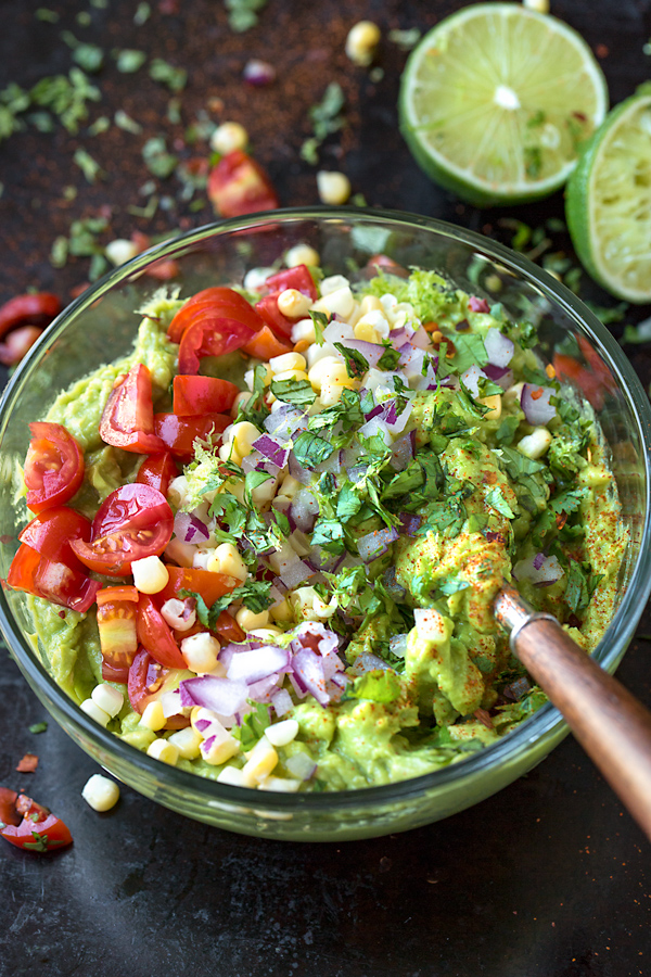 Easy Guacamole being prepared with all the delicious mix-ins | thecozyapron.com