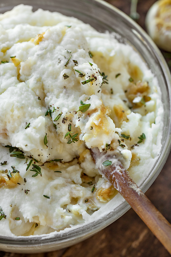 A large bowl of Roasted Garlic Mashed Potatoes | thecozyapron.com