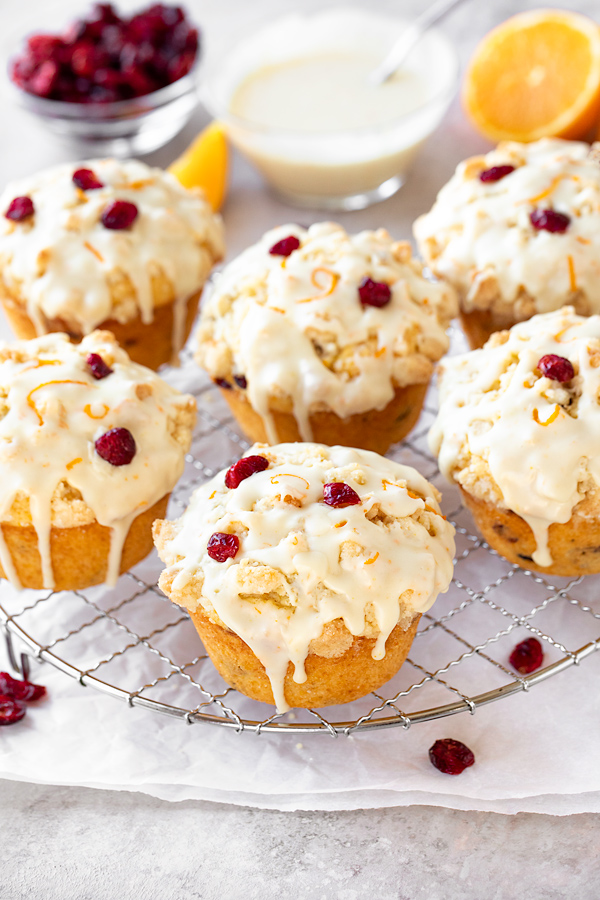Glazed Cranberry Orange Muffins on Wire Rack | thecozyapron.com
