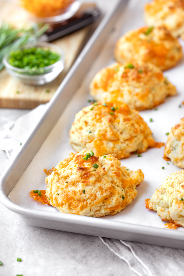 Freshly Baked Drop Biscuits on Baking Sheet | thecozyapron.com