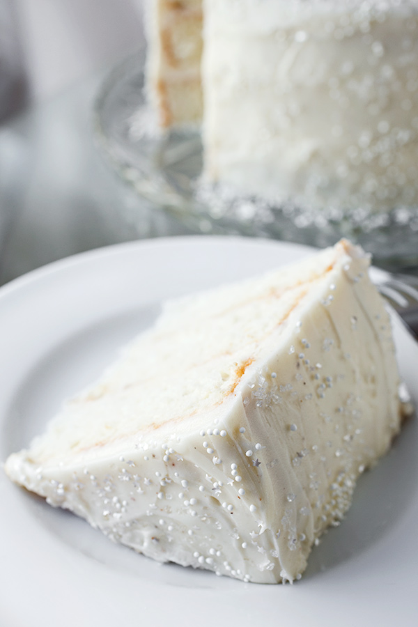 Slice of Eggnog Cake with Fluffy Eggnog Frosting | thecozyapron.com