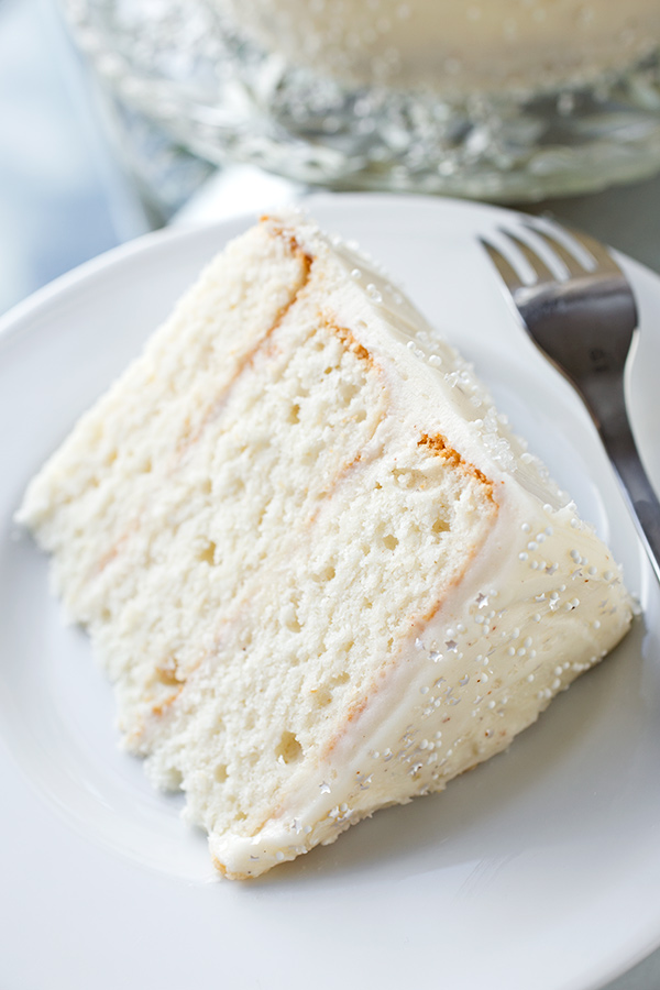 Slice of Eggnog Cake with Fluffy Eggnog Frosting | thecozyapron.com