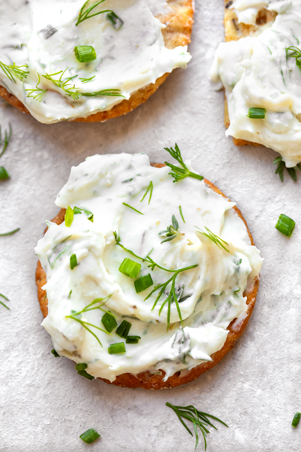 Creamy Garlic and Herb Cheese Spread on a Cracker | thecozyapron.com