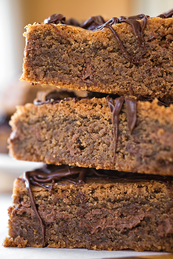 Close up of a stack of Chocolate Peanut Butter Bars | thecozyapron.com