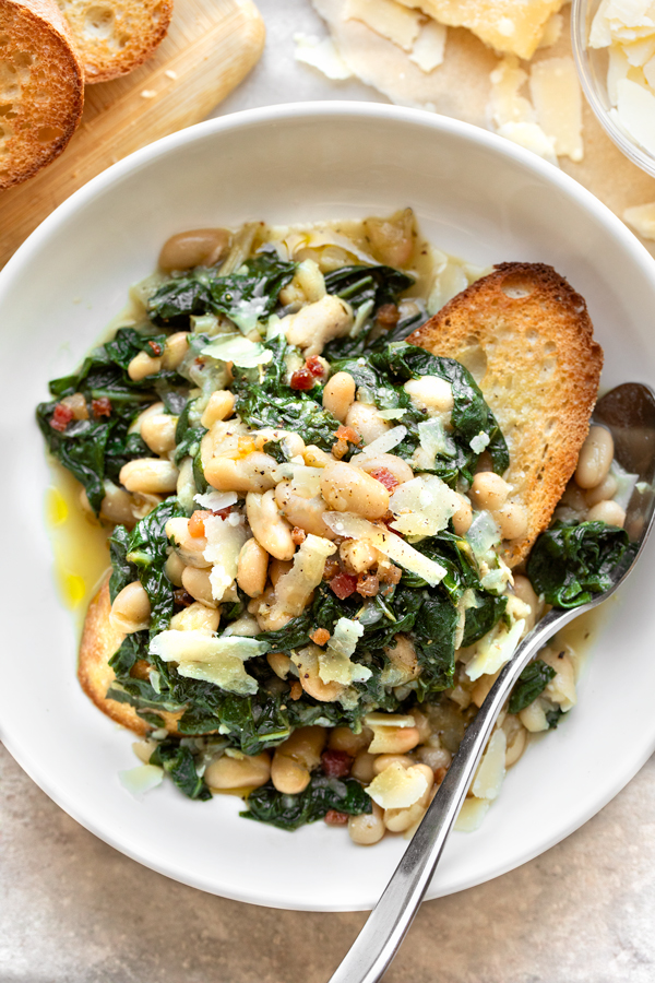 Beans and Greens over Toasted Garlic Bread in a bowl | thecozyapron.com