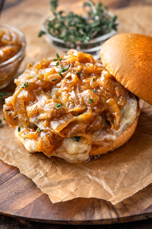 Close-up of caramelized onion sauce on an open-faced French Onion Burger | thecozyapron.com